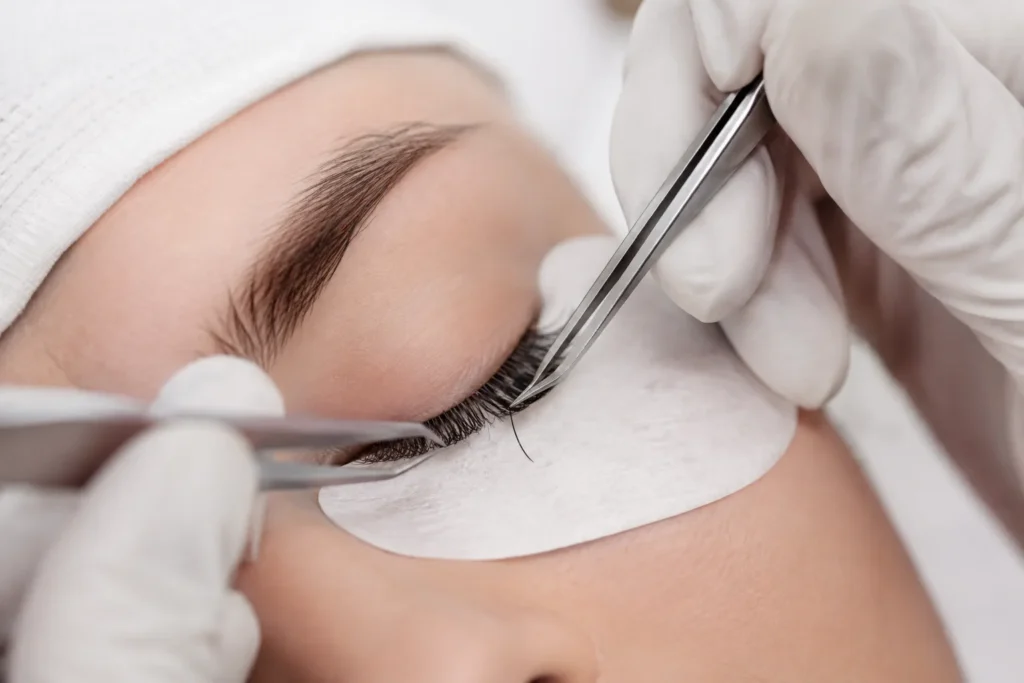 10 Beauty Business Ideas Perfect for Beauty Lovers 5 Close up of a lash technician applying individual lash extensions to a client