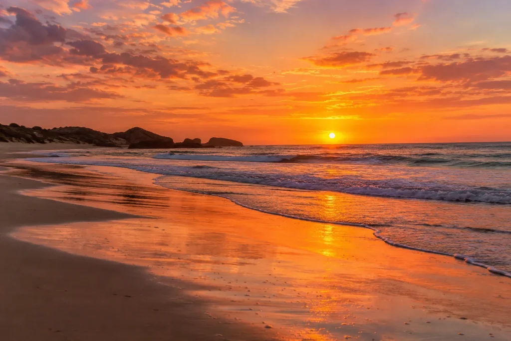 10 Nature Water Views That Feel Pure and Peaceful 10 Wide sandy beach at sunset with reflective wet sand