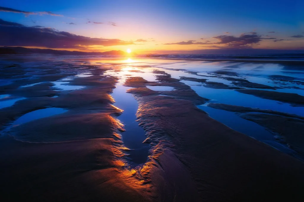 10 Nature Water Views That Feel Pure and Peaceful 5 alm ocean beach at low tide during golden evening light